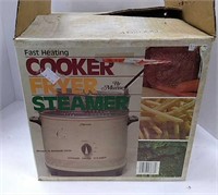 Vintage Munsey cooker, new in box