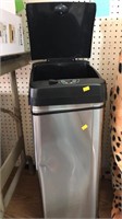 Stainless trash can. Automatic.  Dent.