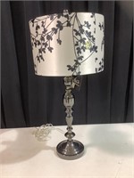 Metal table lamp with floral shade