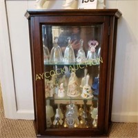 Wood cabinet full of collectible bells (some are