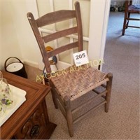 Antique wooden chair with straw seat