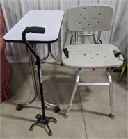 Shower seat with strap, white table on wheels and