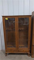 Gun cabinet, pedastal feet, 2 feet broken,