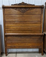 Wooden full size bed frame, approximately 55",