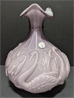 Fenton marked vase with a raised swan pattern.