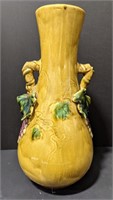 Heavy clay vase with grape leaf design. Measures