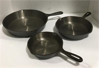 Set of three cast iron skillets "measures