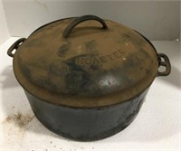 Cast iron roaster measuring approximately 11”