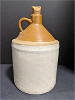Stoneware Whiskey jug with cork. 12 inches tall.