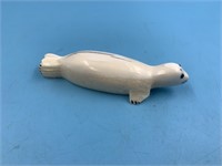 Ivory carving of a seal underside reveals a smokin