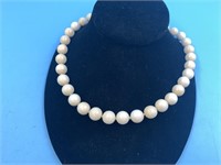 Fossilized ivory necklace with a silver plated lob