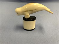 Dennis Pungowiyi ivory carving of a beluga whale o