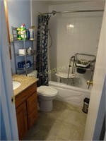 Hall Bathroom contents- shower chair, linen rack,