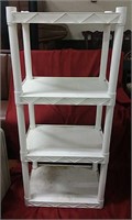 Plastic shelving  stand, measures approx  r8.5"h