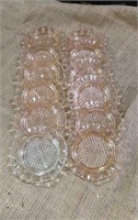 12 Depression glass coasters (11 pink 1 clear)