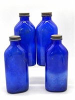 (4) Blue Glass Bottles 8”