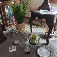 Assorted items such as artificial plant,