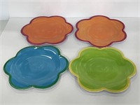 Four painted colorful flower shaped kids plates