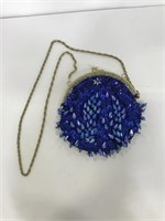Blue beaded evening purse with gold shoulder chain