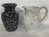 Black speckled ceramic vase and white pitcher