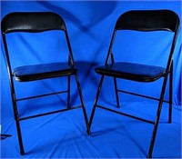 2 black folding chairs 18" x 16" x 31"H