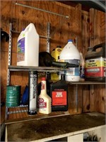 3 Small Shelves With Oils And Household Liquids.