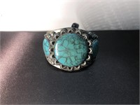 Turquoise and silver cuff bracelet. Do not know