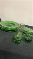 Group of green glass plates, cups