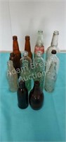 15 assorted soda bottles, beer bottles, glass