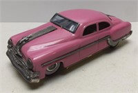 Tin Friction Oldsmobile Sedan Toy Car
Measures