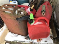 Three Plastic Gas Cans & a Metal Jerry Can