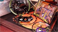 Four colorful glass Halloween plates including