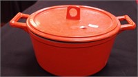 Orange cast iron dutch oven with lid, 10 1/2"