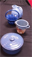 Four blue kitchen pottery items: a tilting