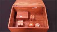 Three wood puzzles, a wood inlaid music box,