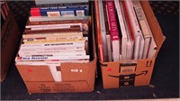 Two boxes of books including home decor,