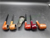 Five smoking pipes and metal stand