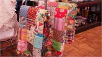 Three handsewn and machined quilts; 78" x 100",
