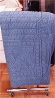 Contemporary machine quilted blue coverlet,