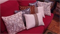 Group of seven decorative pillows with beads