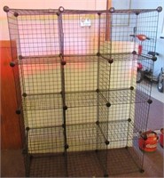 Wire rack. Measures: 59" T x 44.5" W x 15" D.