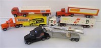 Lot of semi trucks and trailers including