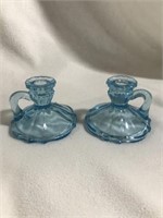 2 light blue glass candle stick holders