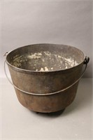 THREE FOOTED CAST POT  WITH HANDLE 10X11X9