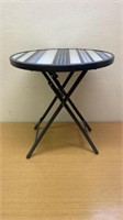 Metal folding table top is 18 inches in diameter