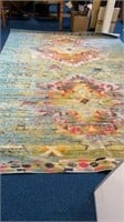 Multicolored 12’x10’ area rug.