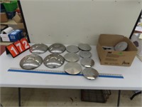 4 TIN HUBCAPS AND PLASTIC CENTER SECTIONS