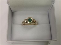 14k yellow gold Emerald Ring features .75ct round