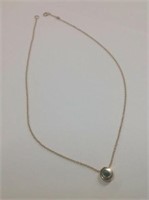 14k yellow gold Emerald Pendant and chain features