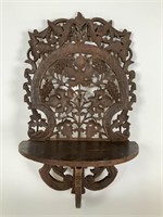 Carved wood folding shelf